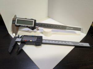 2 sets of calipers, a metal set, and a composite set.