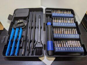 a precision screwdriver set, including a handle, many bits, and other tools