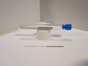 a set of small needles in a tube, they look identical to acupuncture needles